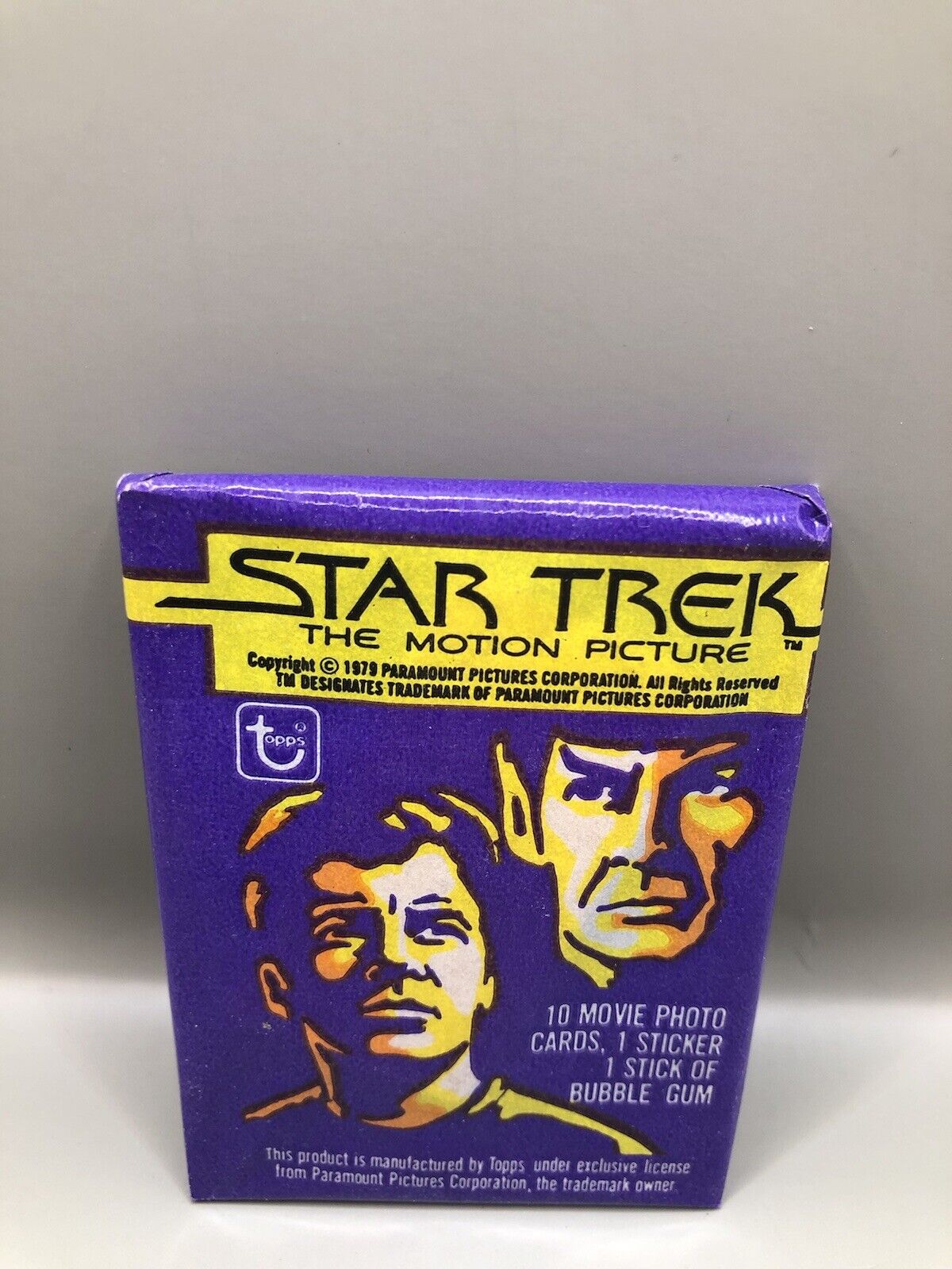Sealed 1979 Topps Star Trek: The Motion Picture trading card pack featuring iconic characters with 10 movie photo cards, 1 sticker, and 1 stick of bubble gum.