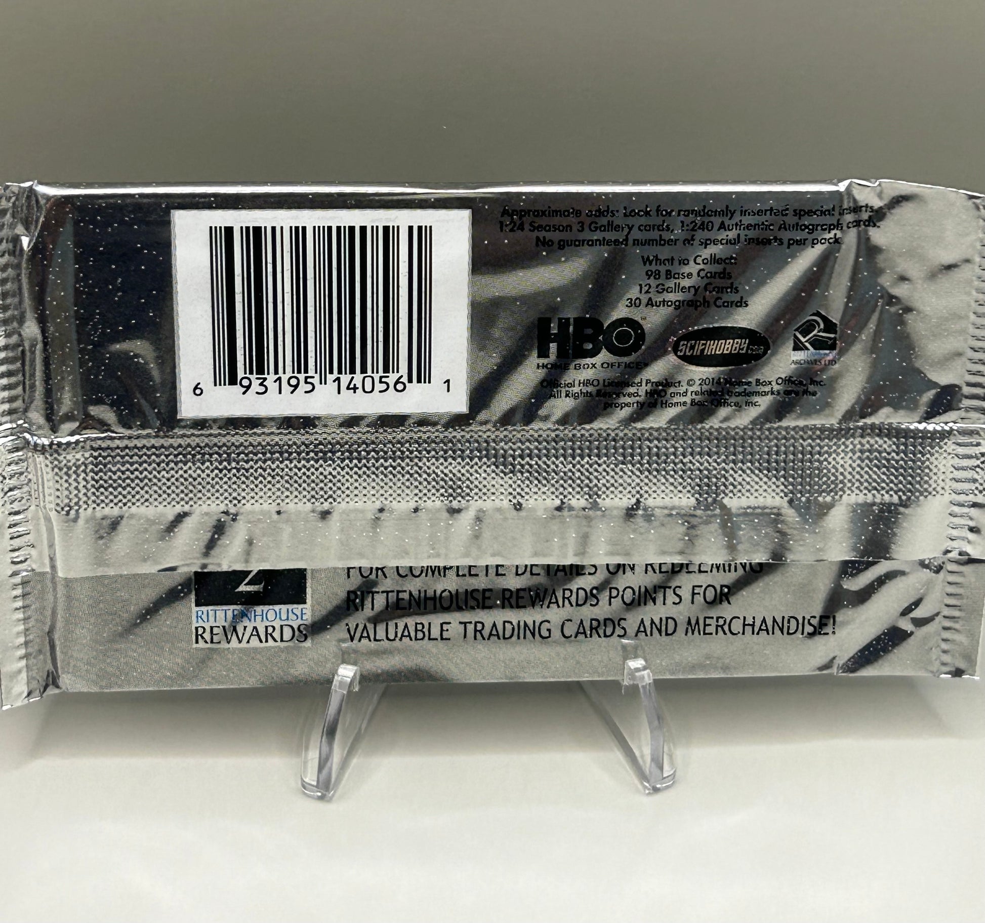 Back view of a sealed Game of Thrones Season 3 trading card pack showing barcode, licensing details, and collectible card odds