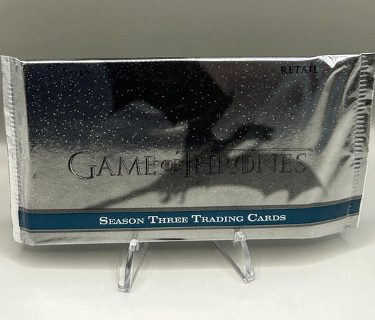 Front view of a sealed Game of Thrones Season 3 trading card pack by Rittenhouse, featuring a dragon silhouette and retail labeling.