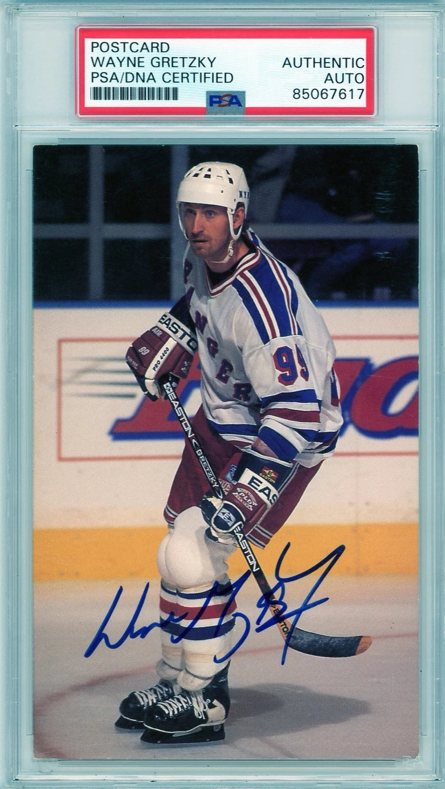Front of PSA/DNA encapsulated Wayne Gretzky signed postcard showing him skating with the New York Rangers